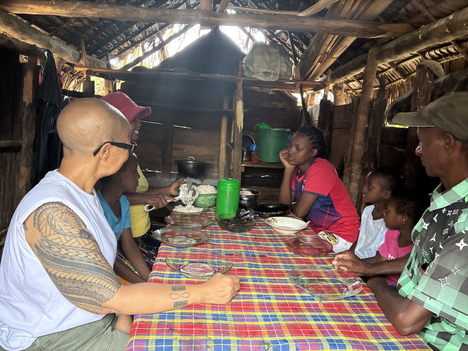 Sharing a meal with a vanilla producer family in Sambava, Madagascar
