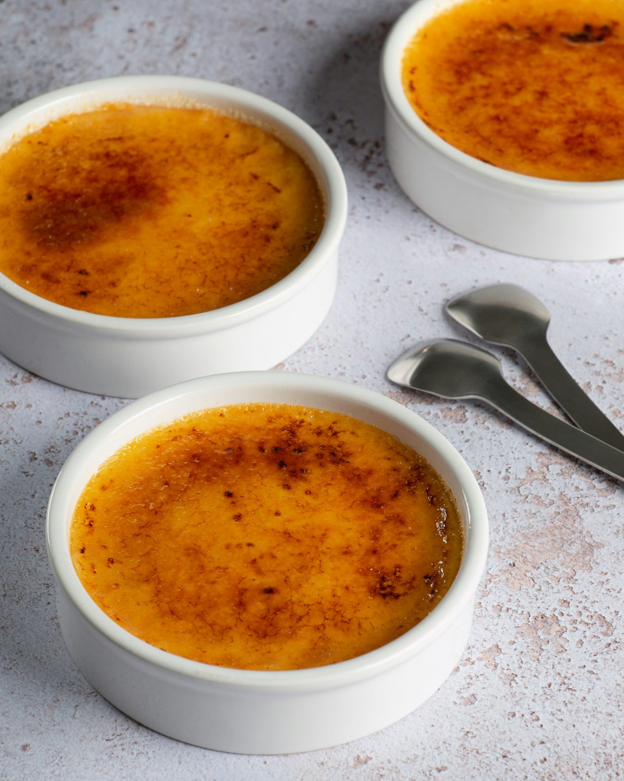 Vanilla bean crème brûlée in ramekins